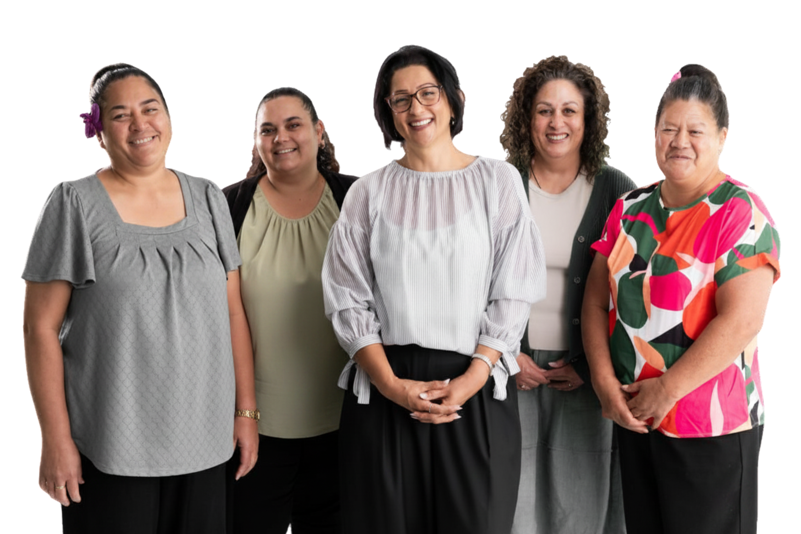 A group women smiling happily at the camera, they are all wearing neutral colours and belong from different ethnicities